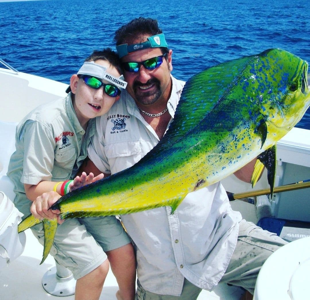 Bruce and a young angler holding a bull mahi